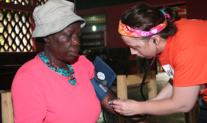 nurse checked the blood pressure of her patient