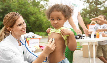 nurse checked the heartbeat of the child