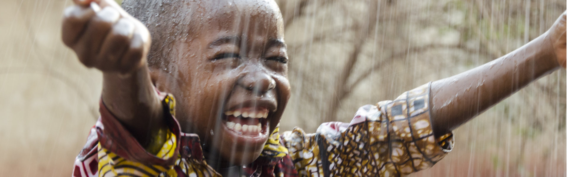 boy enjoy the rain