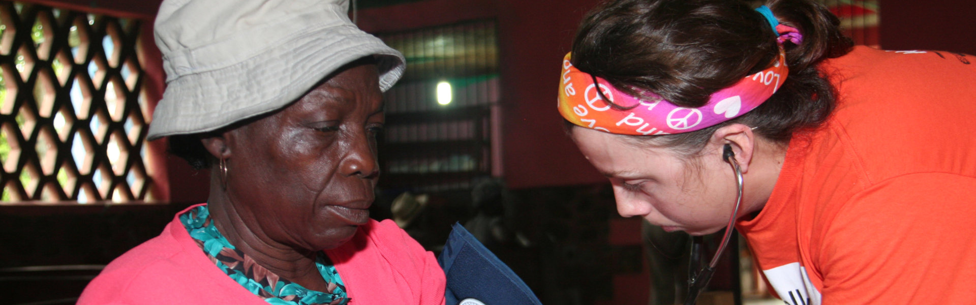 nurse checked the blood pressure of her patient