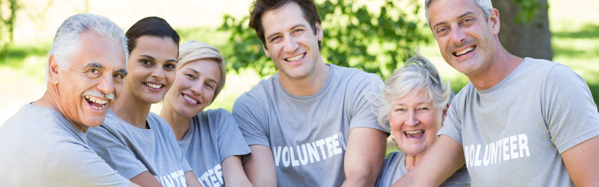 volunteers smile on the camera